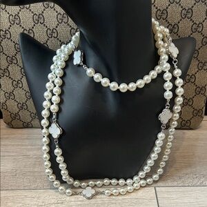 Elegant Pearl Necklace with Silver and White Clover Accents
